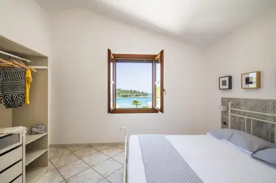 Letto o letti in una camera di Alisei Villa vista mare