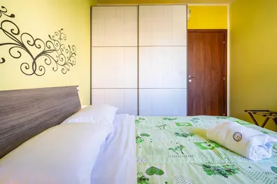 Letto o letti in una camera di Holos Apartment