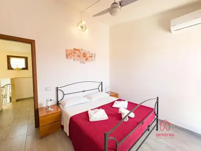 Letto o letti in una camera di Maison Giselle, piscina e mare