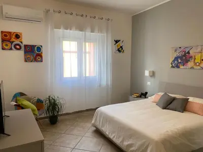 Letto o letti in una camera di Donna Merla