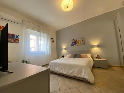 Letto o letti in una camera di Donna Merla