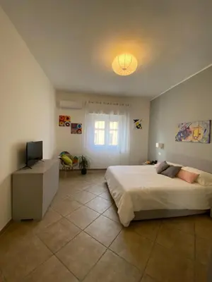 Letto o letti in una camera di Donna Merla