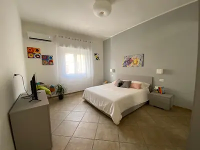 Letto o letti in una camera di Donna Merla