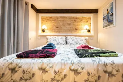 Letto o letti in una camera di Vintage Suite