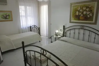 Letto o letti in una camera di B&B Terre del Sinis