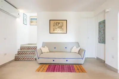 Area soggiorno di Villa Punta delle Oche by CFSuites