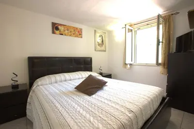 Letto o letti in una camera di GuestHost - Sonja's Home Dolianova