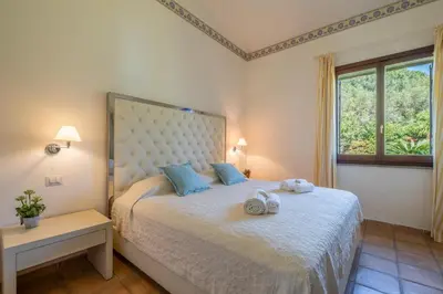 Letto o letti in una camera di Villa Lusso Santa Margherita di Pula 3 Minuti dal Mare