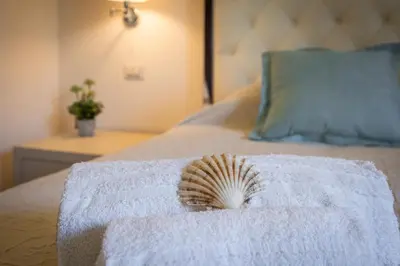Letto o letti in una camera di Villa Lusso Santa Margherita di Pula 3 Minuti dal Mare