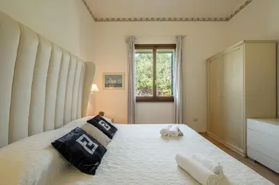 Letto o letti in una camera di Villa Lusso Santa Margherita di Pula 3 Minuti dal Mare
