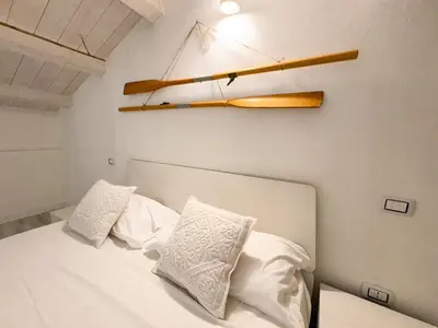 Letto o letti in una camera di Kalma Lux - Sant Efisio Lofts