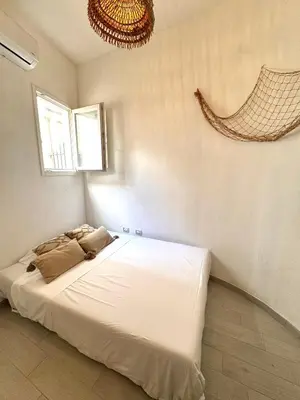 Letto o letti in una camera di Kalma Lux - Sant Efisio Lofts