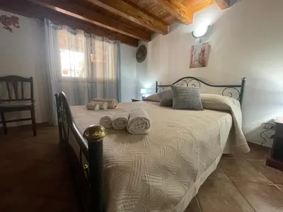 Letto o letti in una camera di La Casa degli Enzi
