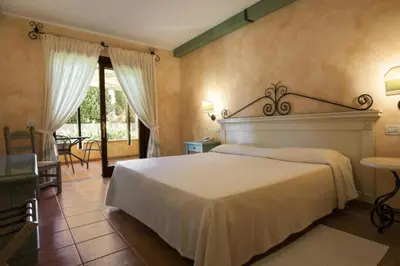 Letto o letti in una camera di Sardinian-style Resort 2 Bedroom Apartments Sleeps 7
