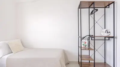 Letto o letti in una camera di Domo Wai