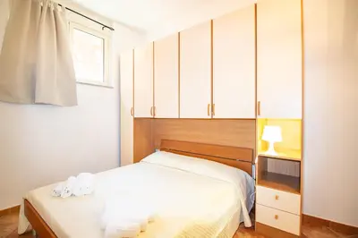 Letto o letti in una camera di Villetta Is Carcuris