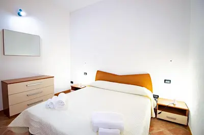 Letto o letti in una camera di Villetta Is Carcuris
