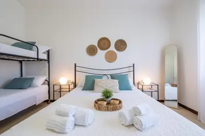 Letto o letti in una camera di Casa Valsimon immersa nel verde