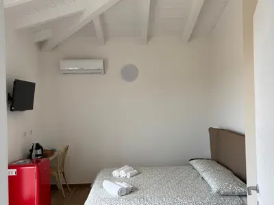 Letto o letti in una camera di Domo Il Tramonto Giba