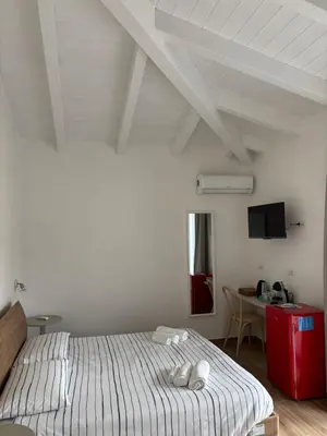 Letto o letti in una camera di Domo Il Tramonto Giba