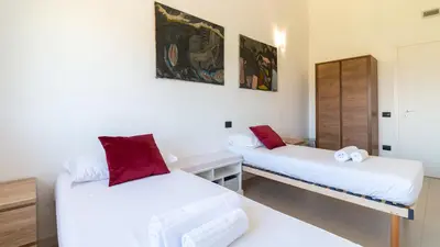 Letto o letti in una camera di Casa D'Autore - Cabras