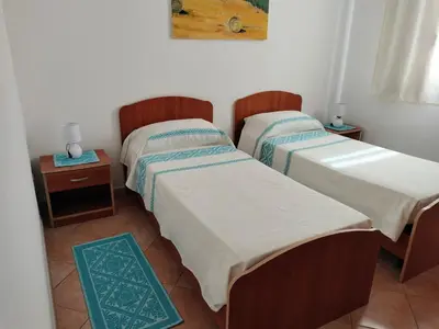 Letto o letti in una camera di Casa Giuliana