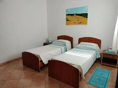 Letto o letti in una camera di Casa Giuliana