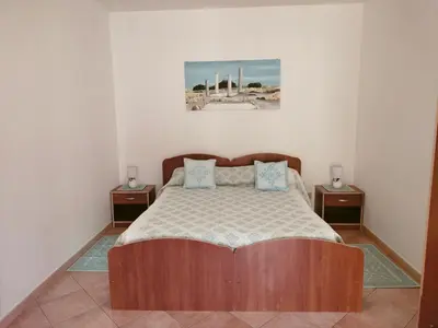 Letto o letti in una camera di Casa Giuliana