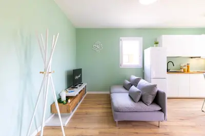 TV o dispositivi per l'intrattenimento presso Chapelle Nove - Green Apartment
