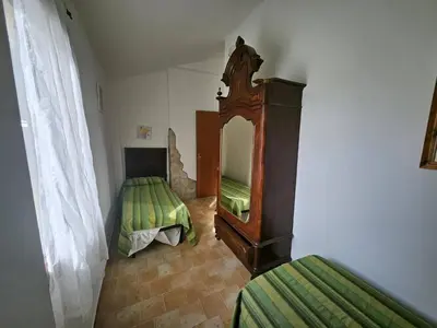 Letto o letti in una camera di Villa Domo Sardo - Masone pardu