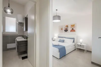 Letto o letti in una camera di Suite Sant'Andrea-250 m from the Beach- Privat Parking-Self Check-in - Netflix