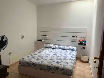 Letto o letti in una camera di Casetta Storica Sotto Torre