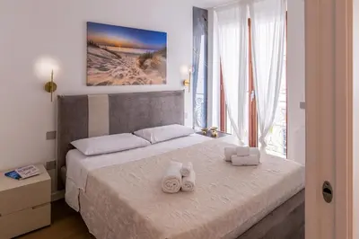 Letto o letti in una camera di Caralis Golden House Luxury and charm in Cagliari