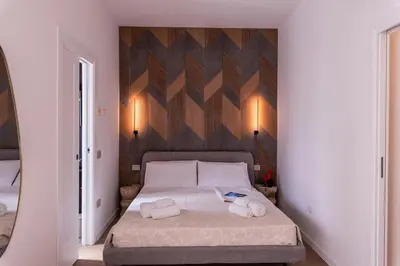 Letto o letti in una camera di Caralis Golden House Luxury and charm in Cagliari