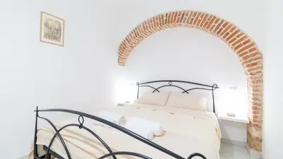 Letto o letti in una camera di Domus Domina