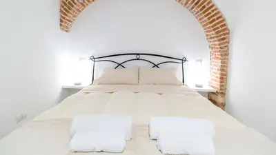 Letto o letti in una camera di Domus Domina