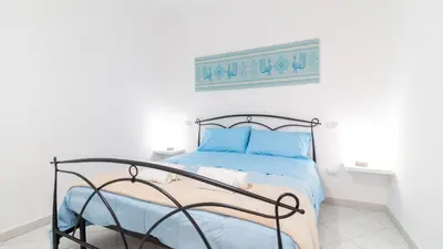 Letto o letti in una camera di Domus Domina