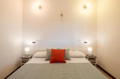 Letto o letti in una camera di 5 minuti a piedi dal mare- appartamento con veranda