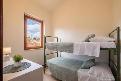 Letto o letti in una camera di 5 minuti a piedi dal mare- appartamento con veranda