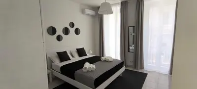 Letto o letti in una camera di Little Button House Marina