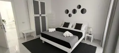 Letto o letti in una camera di Little Button House Marina
