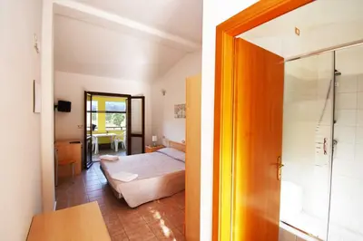 Letto o letti in una camera di La Corte Degli Ulivi