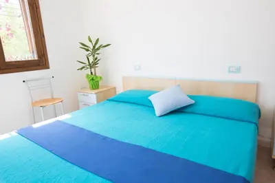 Letto o letti in una camera di La Corte Degli Ulivi