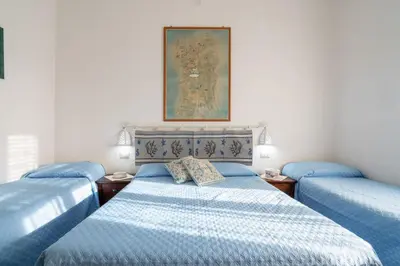 Letto o letti in una camera di Cagliari Central Rooms With Port View