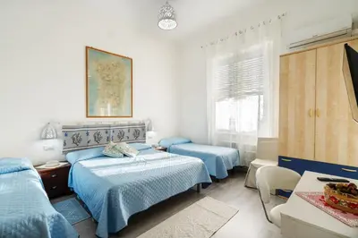 Letto o letti in una camera di Cagliari Central Rooms With Port View