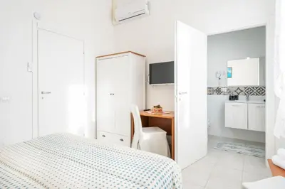 Letto o letti in una camera di Cagliari Central Rooms With Port View