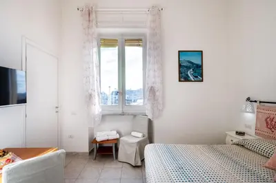 Letto o letti in una camera di Cagliari Central Rooms With Port View