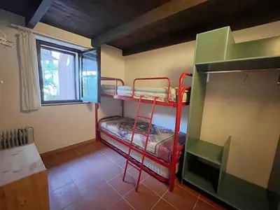 Letto o letti a castello in una camera di Il Gatto di Monte Attu