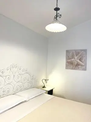 Letto o letti in una camera di Villa Arianna