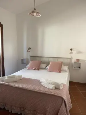 Letto o letti in una camera di Villa Arianna